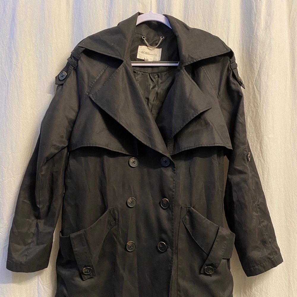 Black button up trench coat.